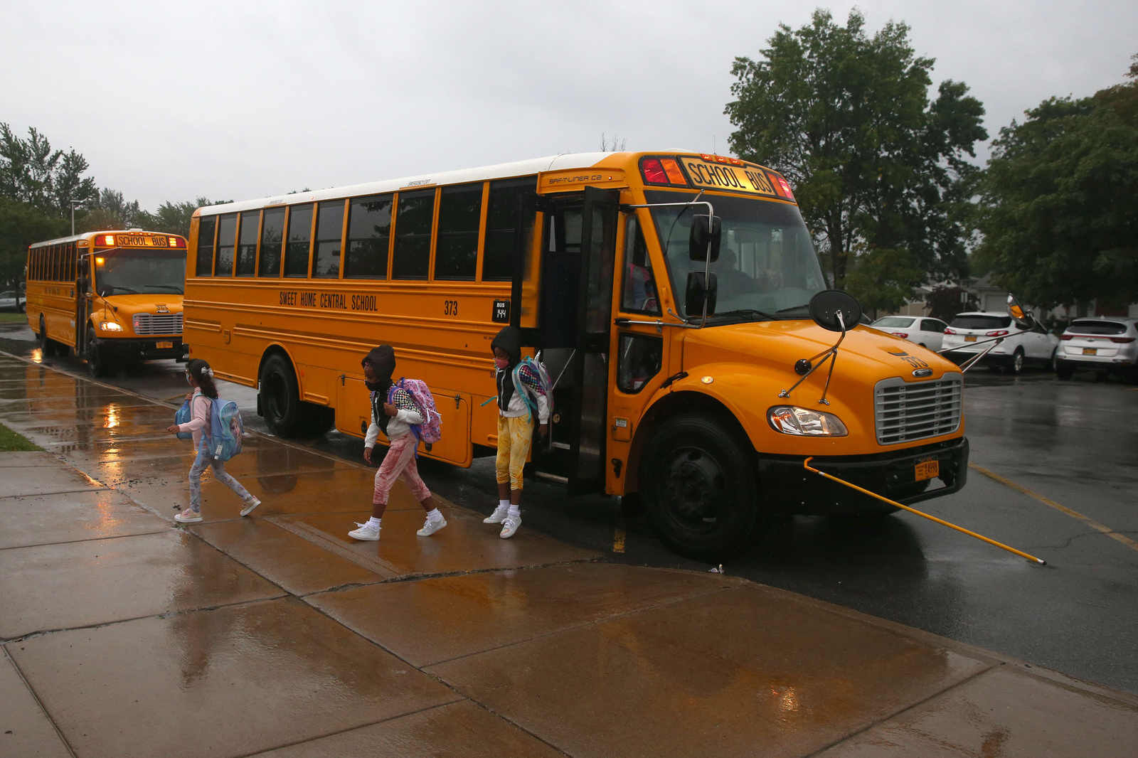 Busses arrive